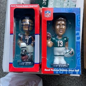 Two bobble heads Marino and Elway